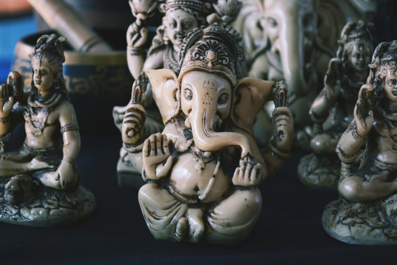 several statues of elephants sitting next to each other