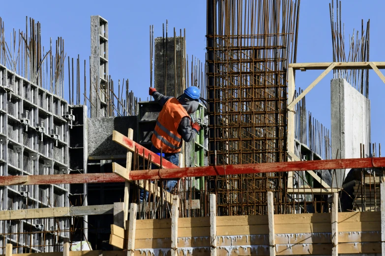 a man on top of a pile of concrete blocks