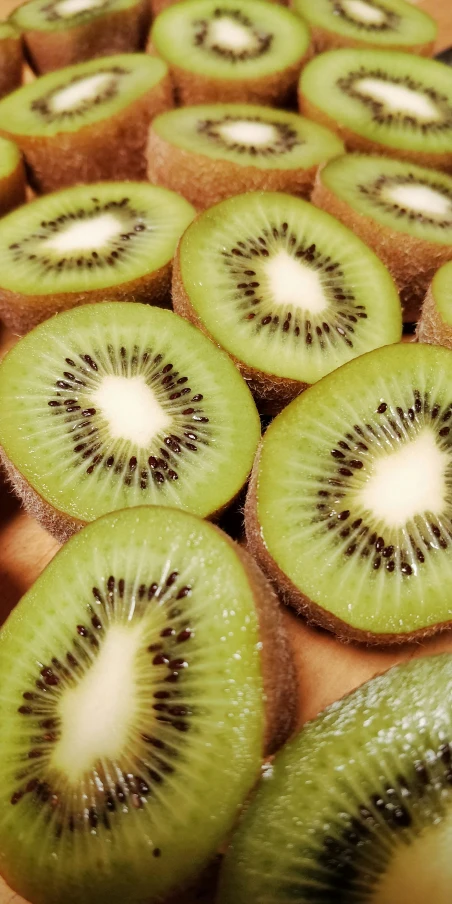 kiwi cut in half and some other pieces being served
