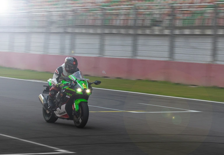 a person is racing on a motorcycle in a race