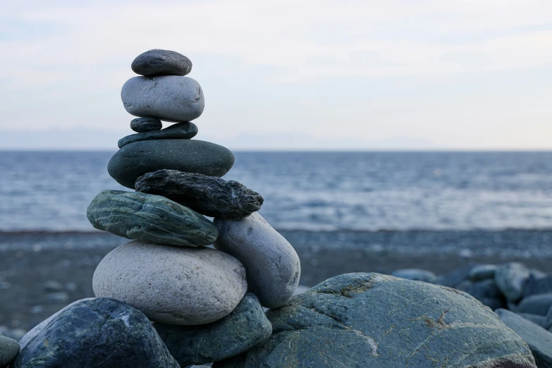 rocks arranged in the shape of balanced stones on a rocky beach