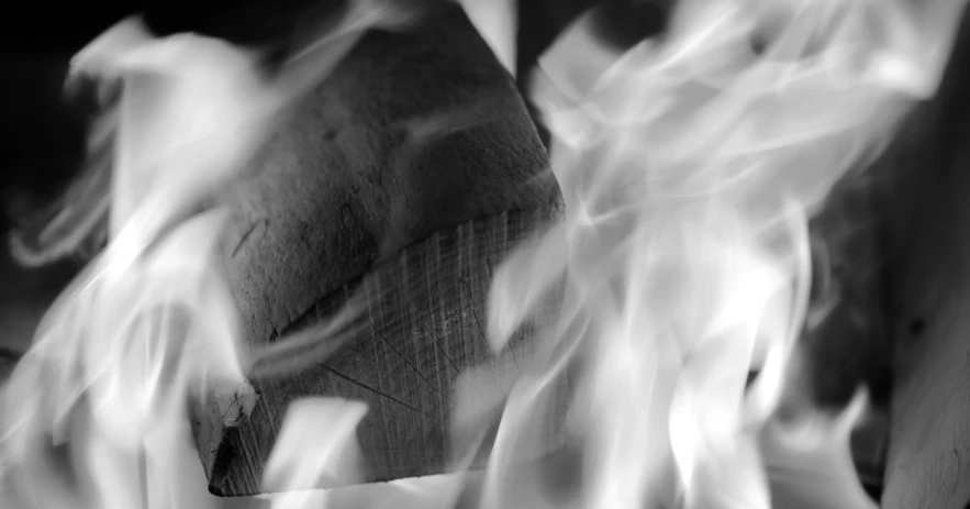 a picture of a wooden box surrounded by fire