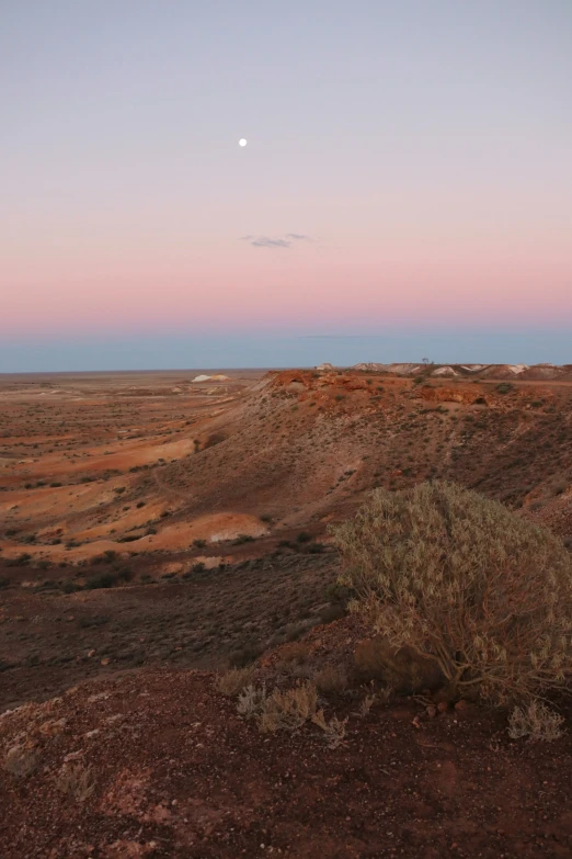 a distant desert landscape with no people, and an empty cloud