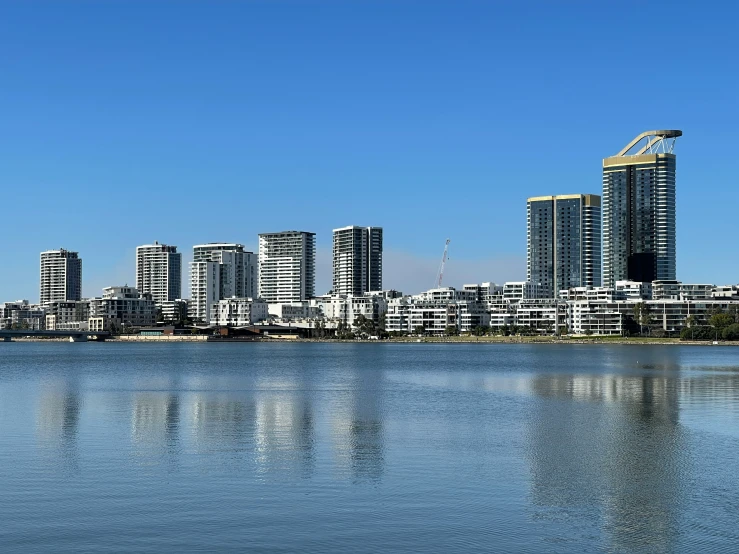 a city skyline next to a large body of water
