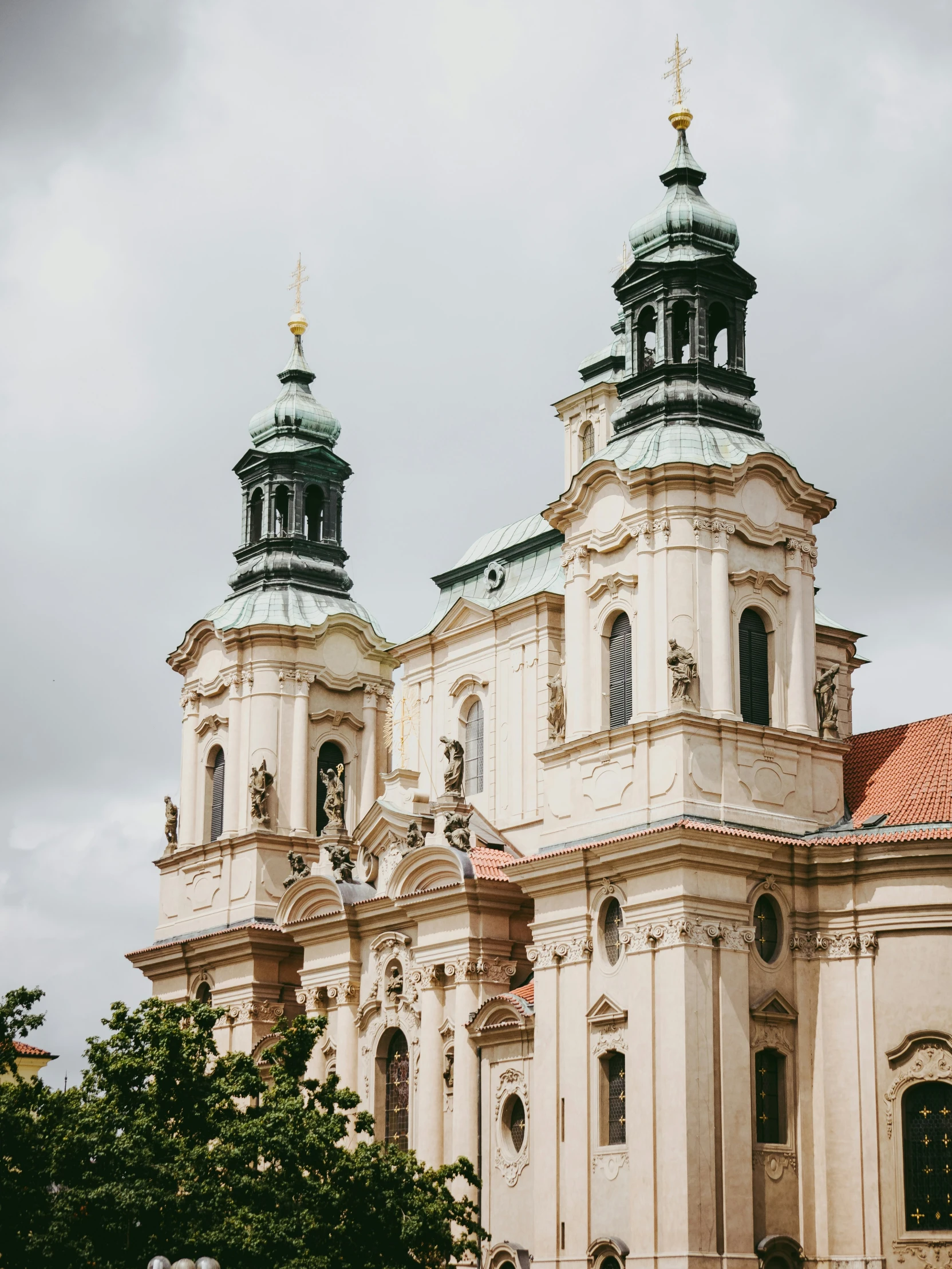 a church that has green steeple tops