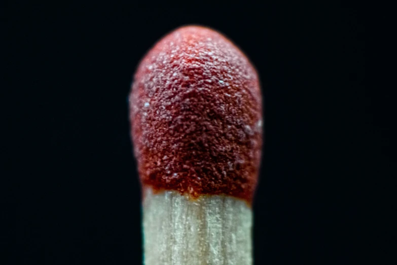 an image of a red toothbrush that is over white