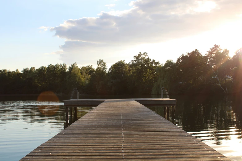 a dock extending into the water to allow people to sit