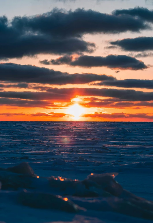 a small piece of ice under a cloudy sky