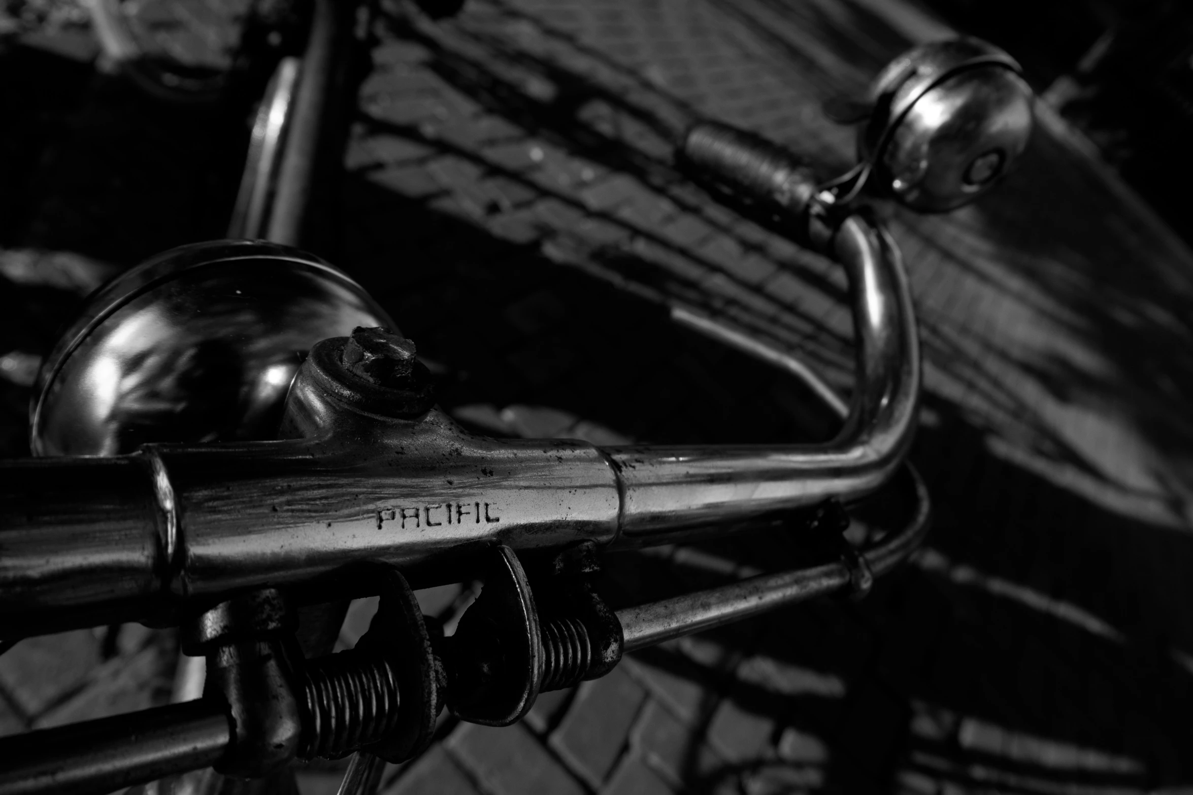 a bicycle is parked on the sidewalk in front of a metal fence