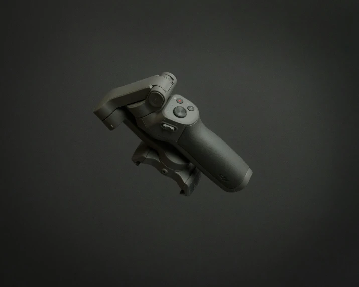 the top view of a black and white po of a controller