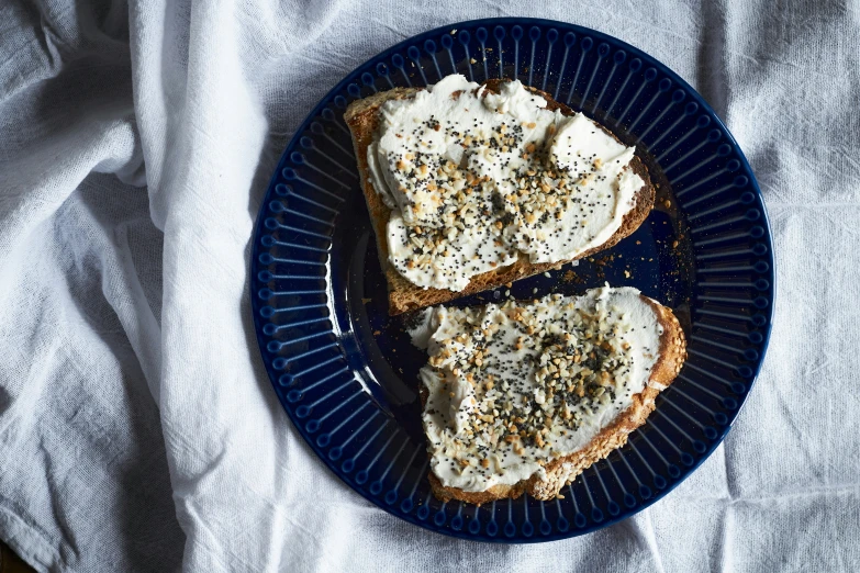 an image of two slices of bread with cream cheese
