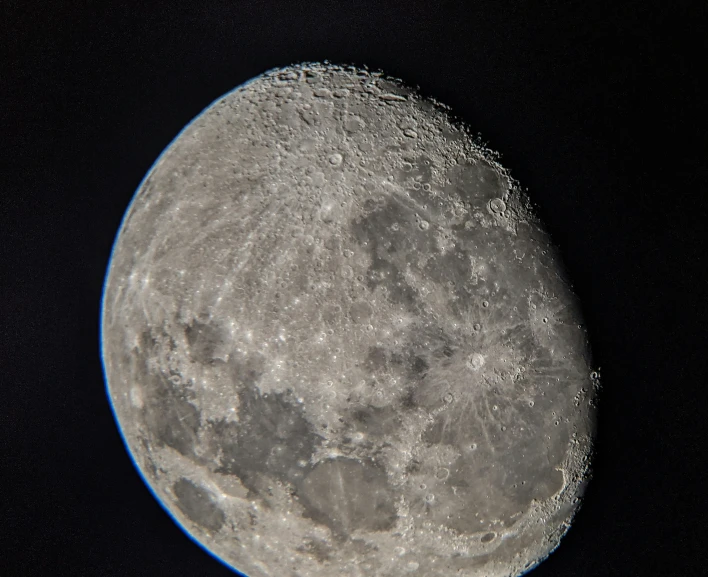 the moon is visible with some blue around it