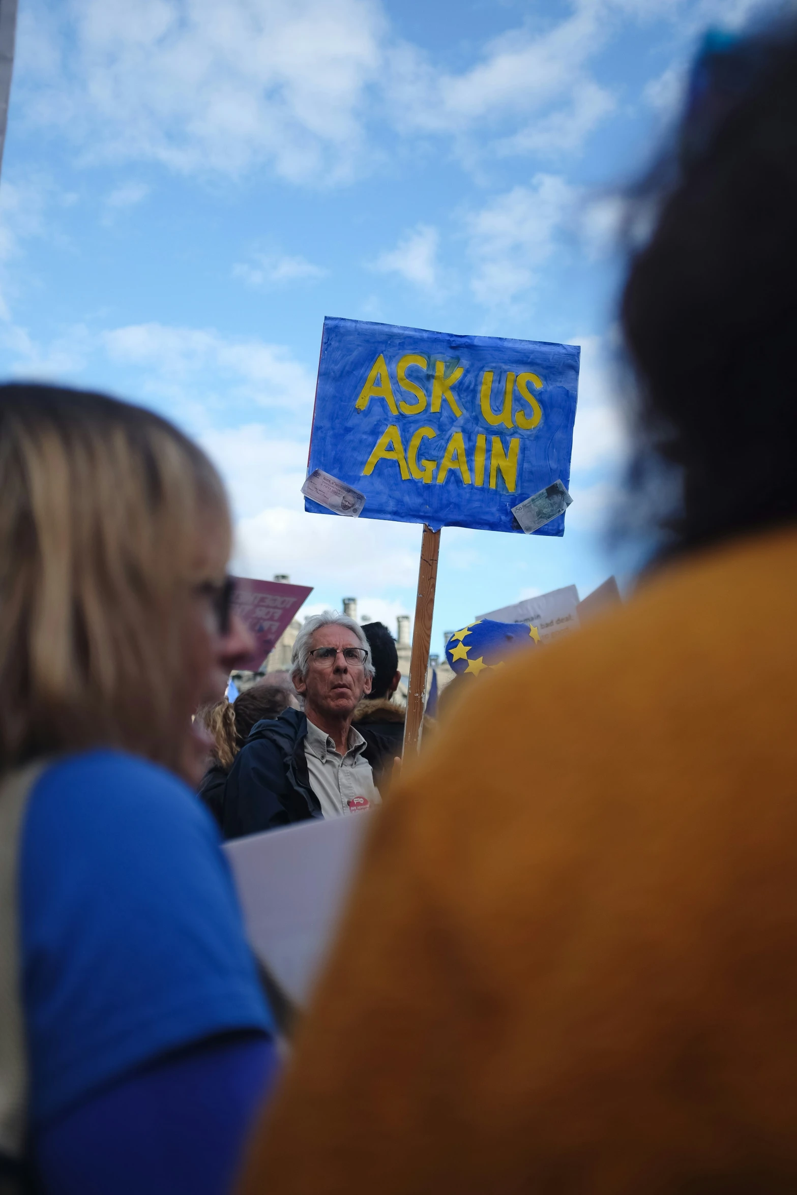 a man with sunglasses on at a demonstration