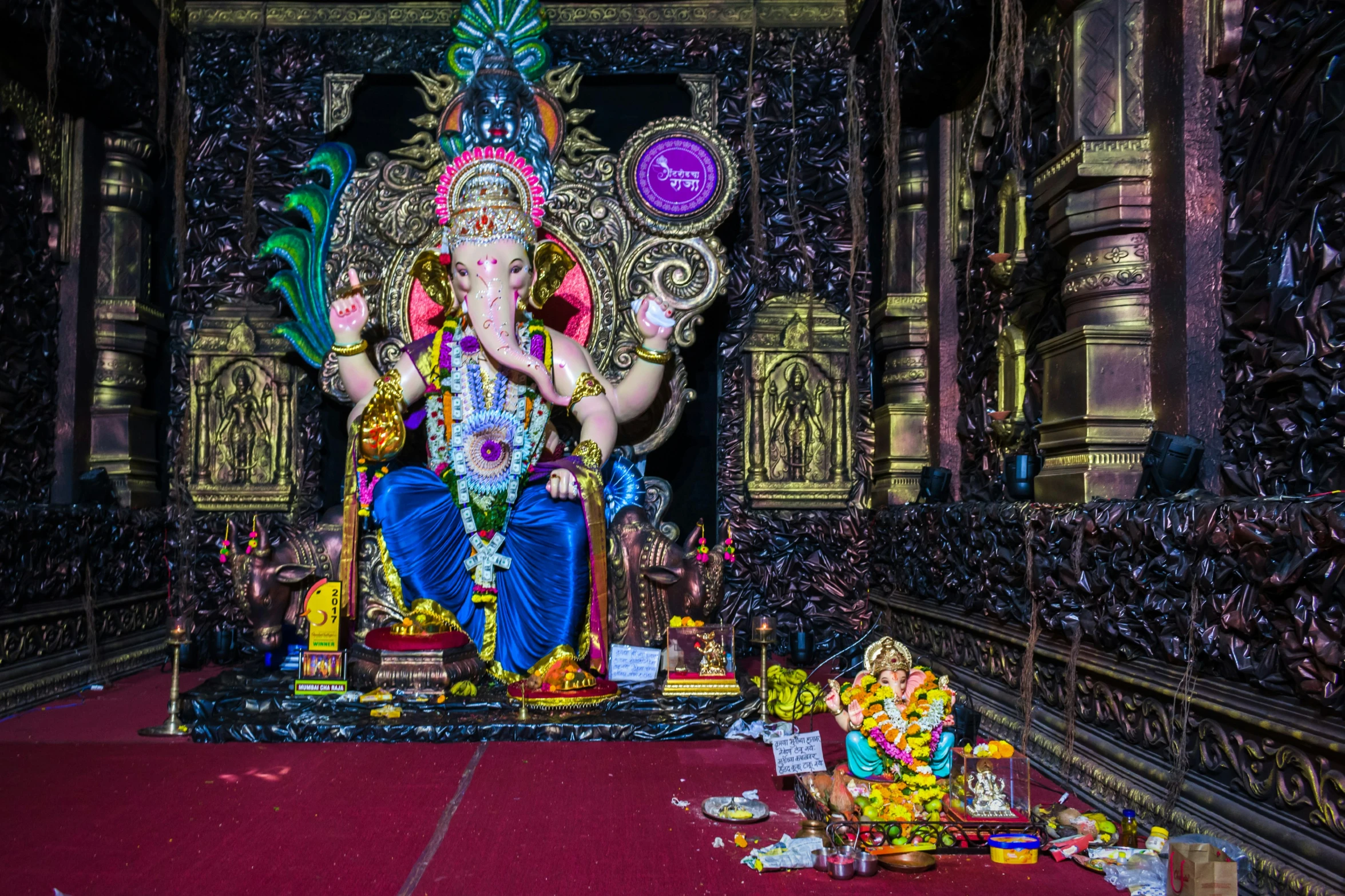 a big statue of lord ganesha inside a temple