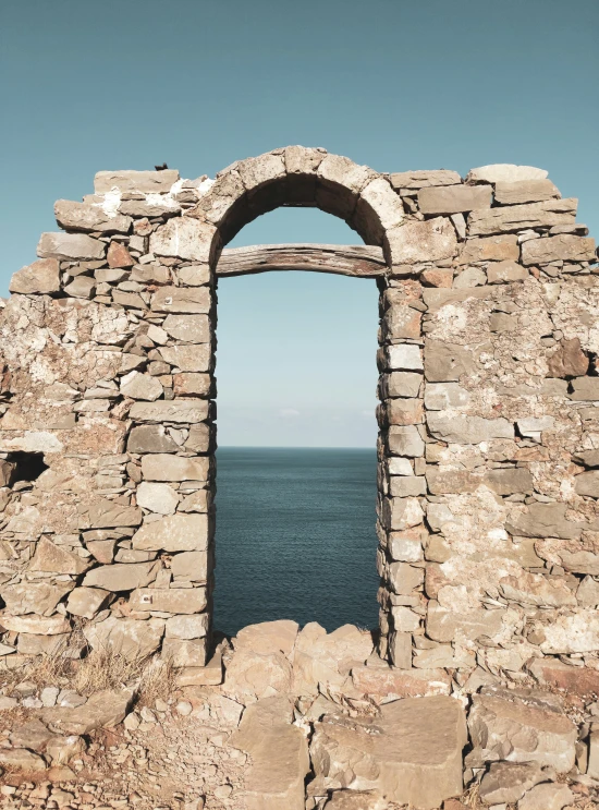 there is a window on top of a building by the ocean