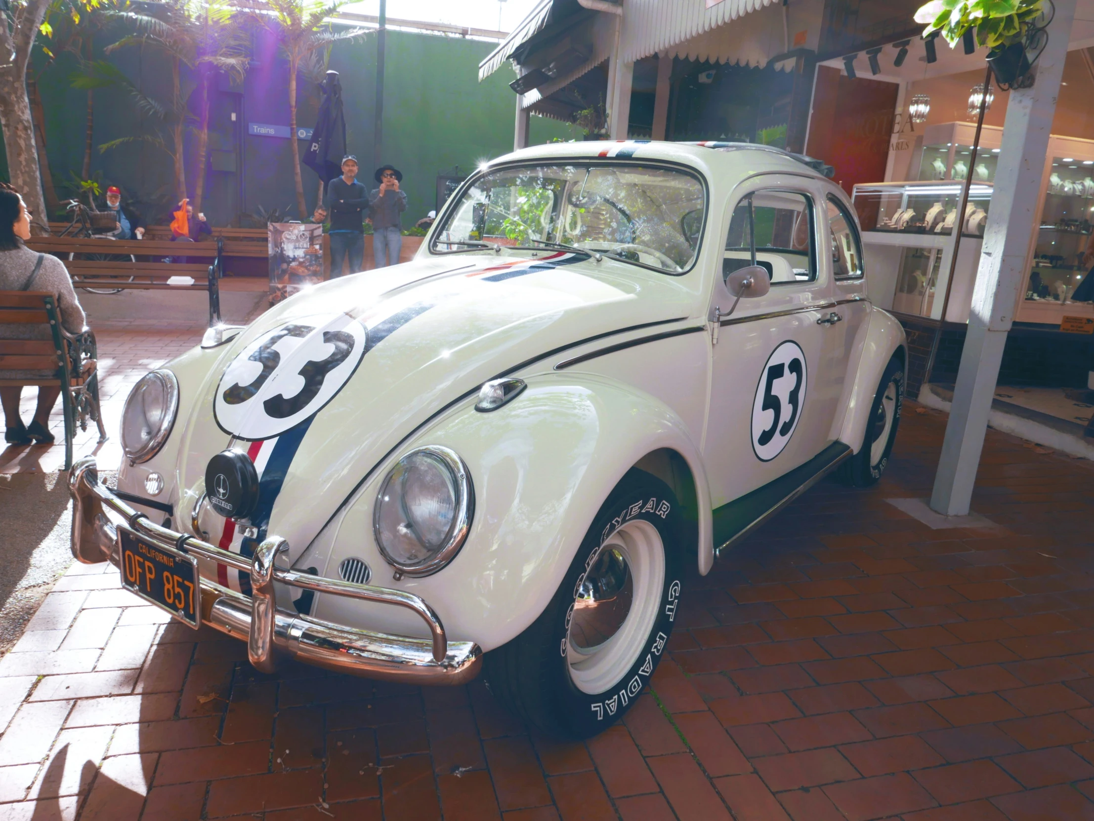 an old style beetle on display at a car show