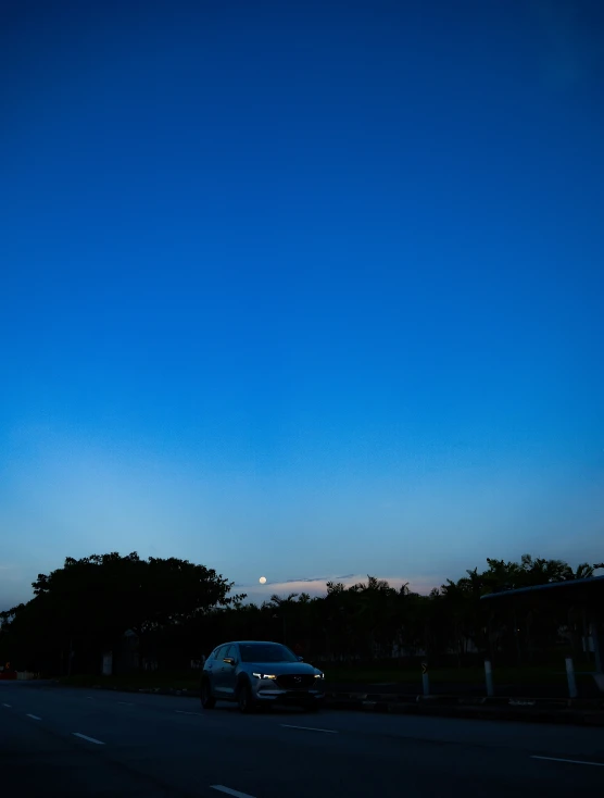 a view of a car parked near the street