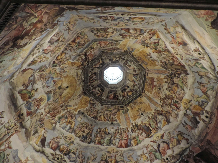 a ceiling painting with figures inside a dome