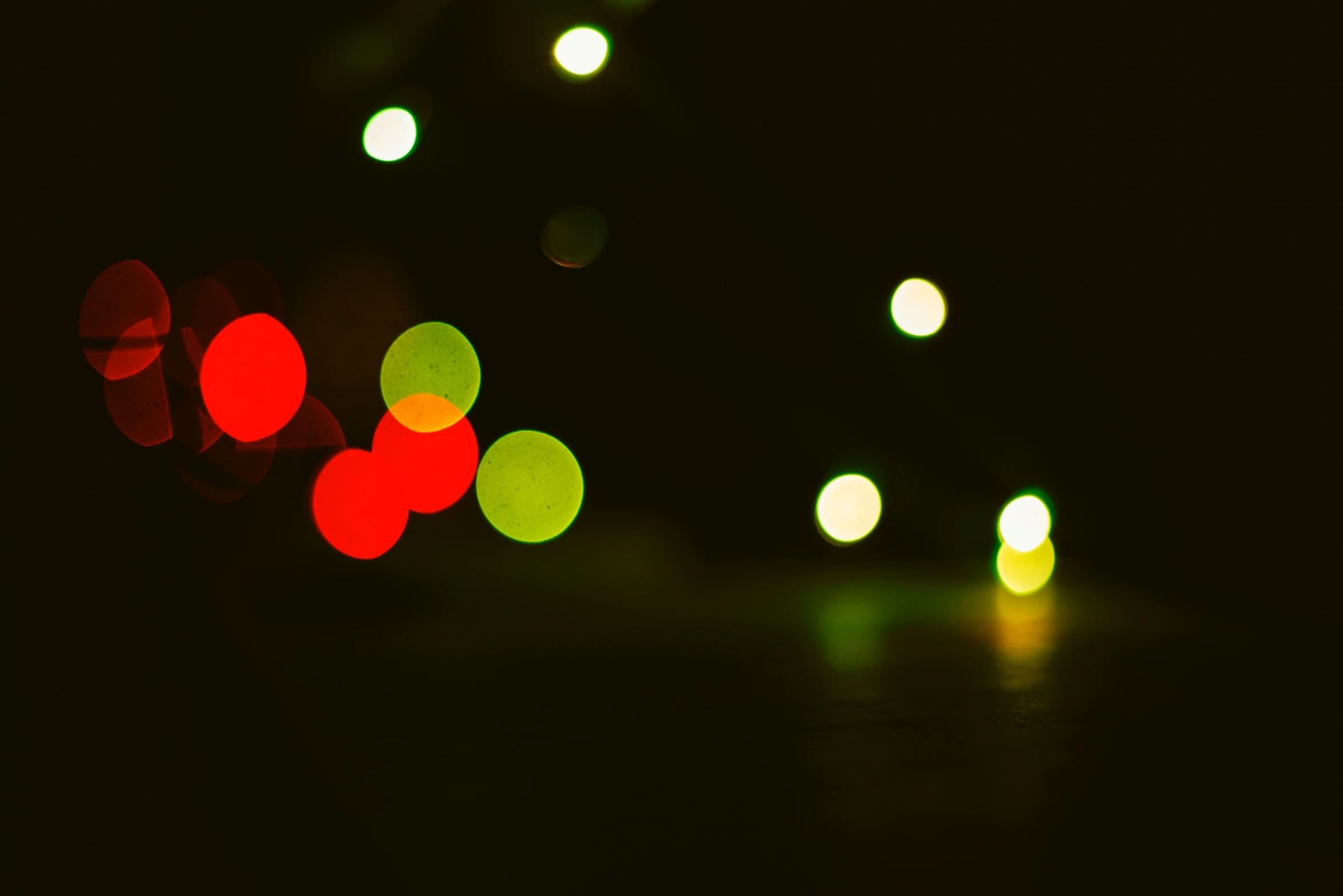 there is a group of colorful traffic lights on the street