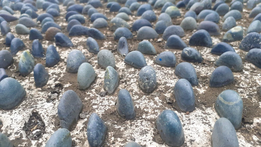 rocks and cement are arranged in rows with white speckles