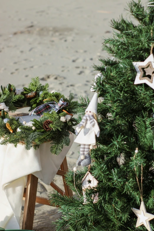 two white christmas decorations sit on top of a table