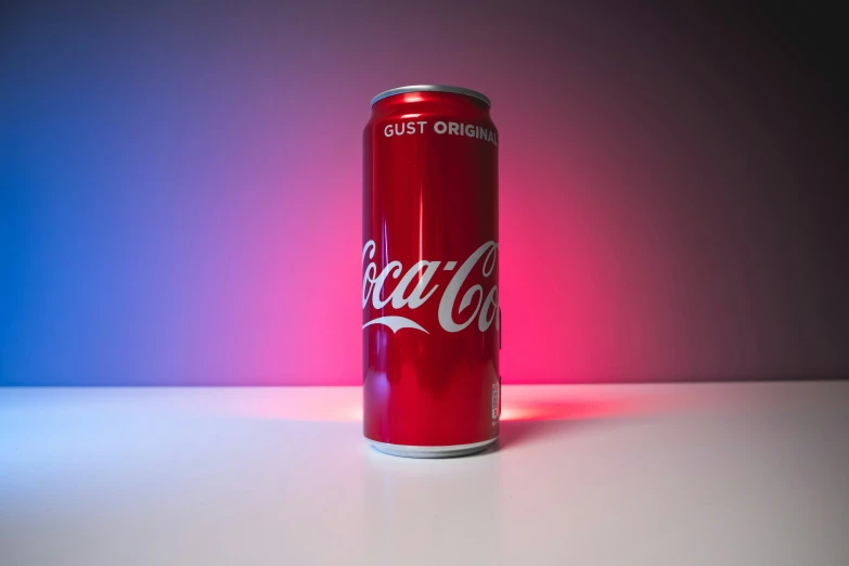 a red can sitting on top of a white table