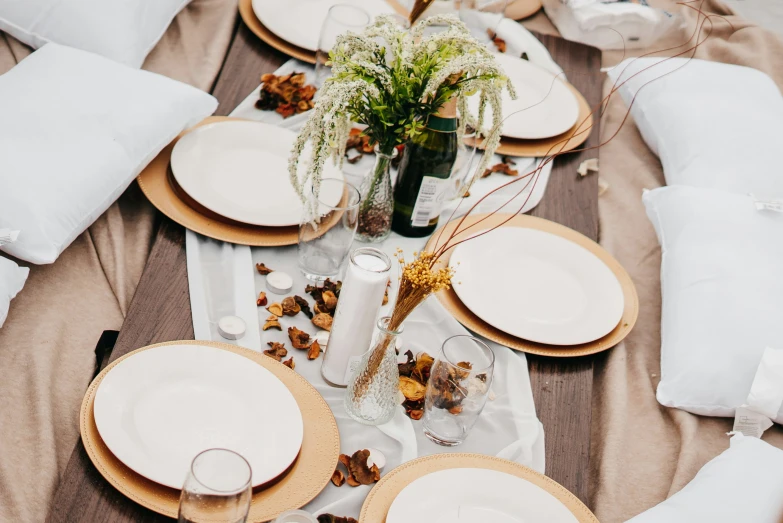 a group of plates and vases that are sitting on a table