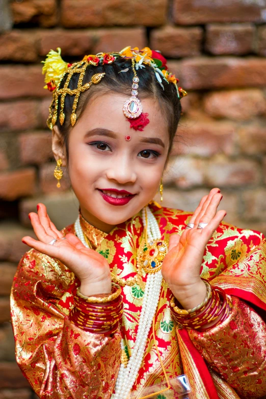  in oriental costume posing for the camera