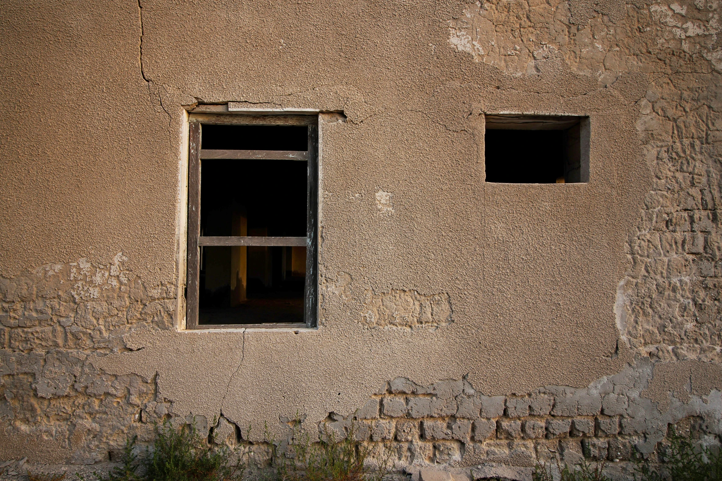 the windows are open in the tan building