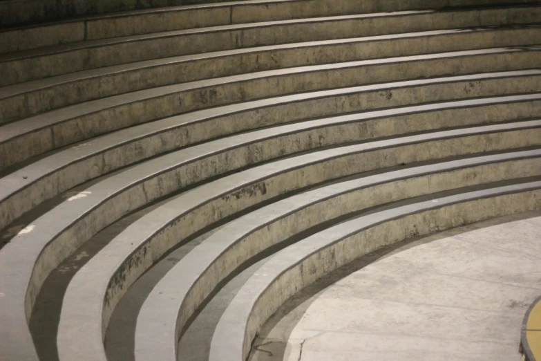 a skateboarder doing a trick on an elevated concrete surface