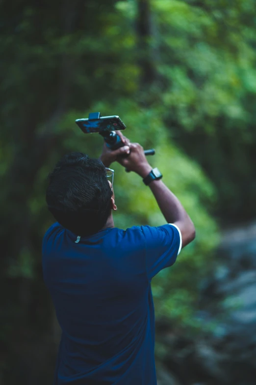 a person with a camera on their arm taking pictures