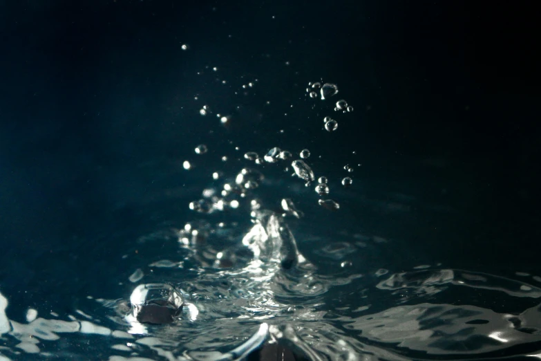 a boat is floating in a dark body of water