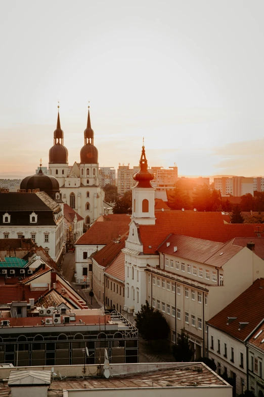 an aerial view of buildings with a clock tower