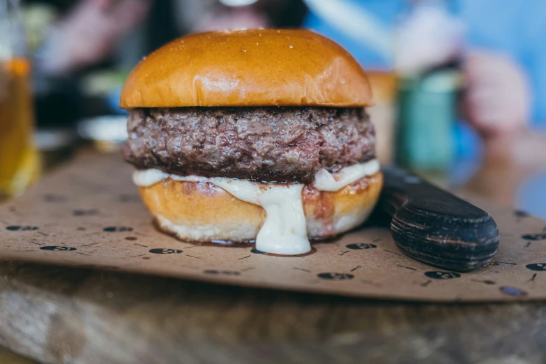 a hamburger is cut into halves on a board