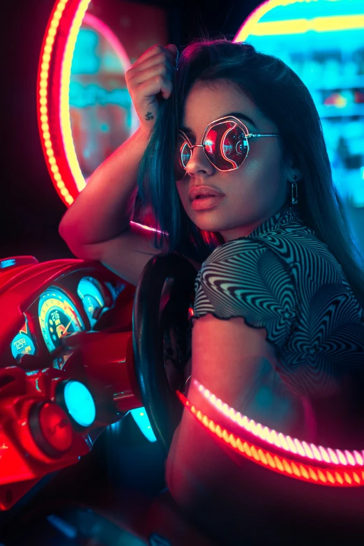 woman with a car wheel and some neon lights
