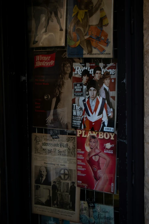 a collection of women's magazines is being displayed on a wall