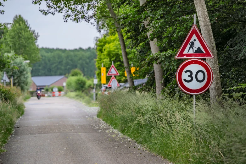 a road sign in the middle of a country side