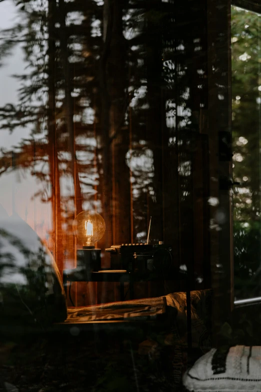 a glass window with sunlight coming in from behind the curtains