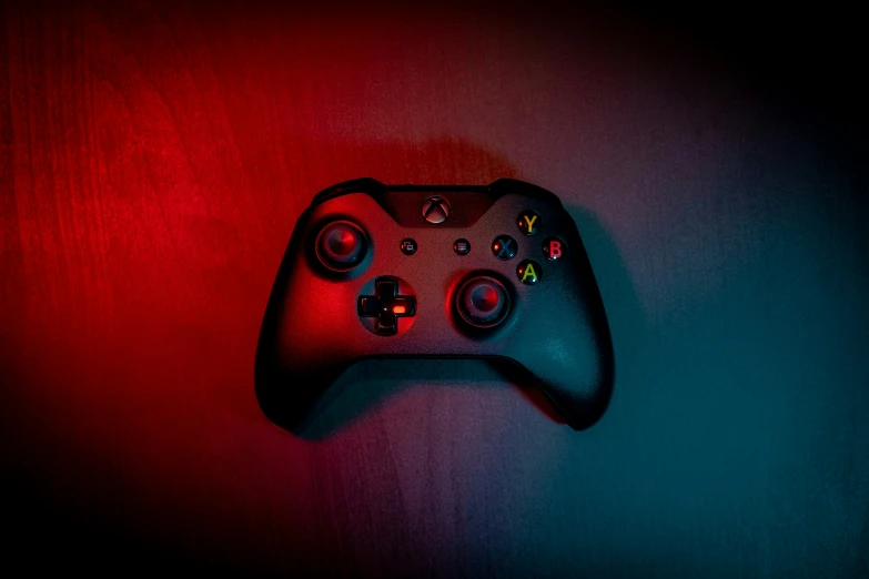 the back of a gaming controller on a red background