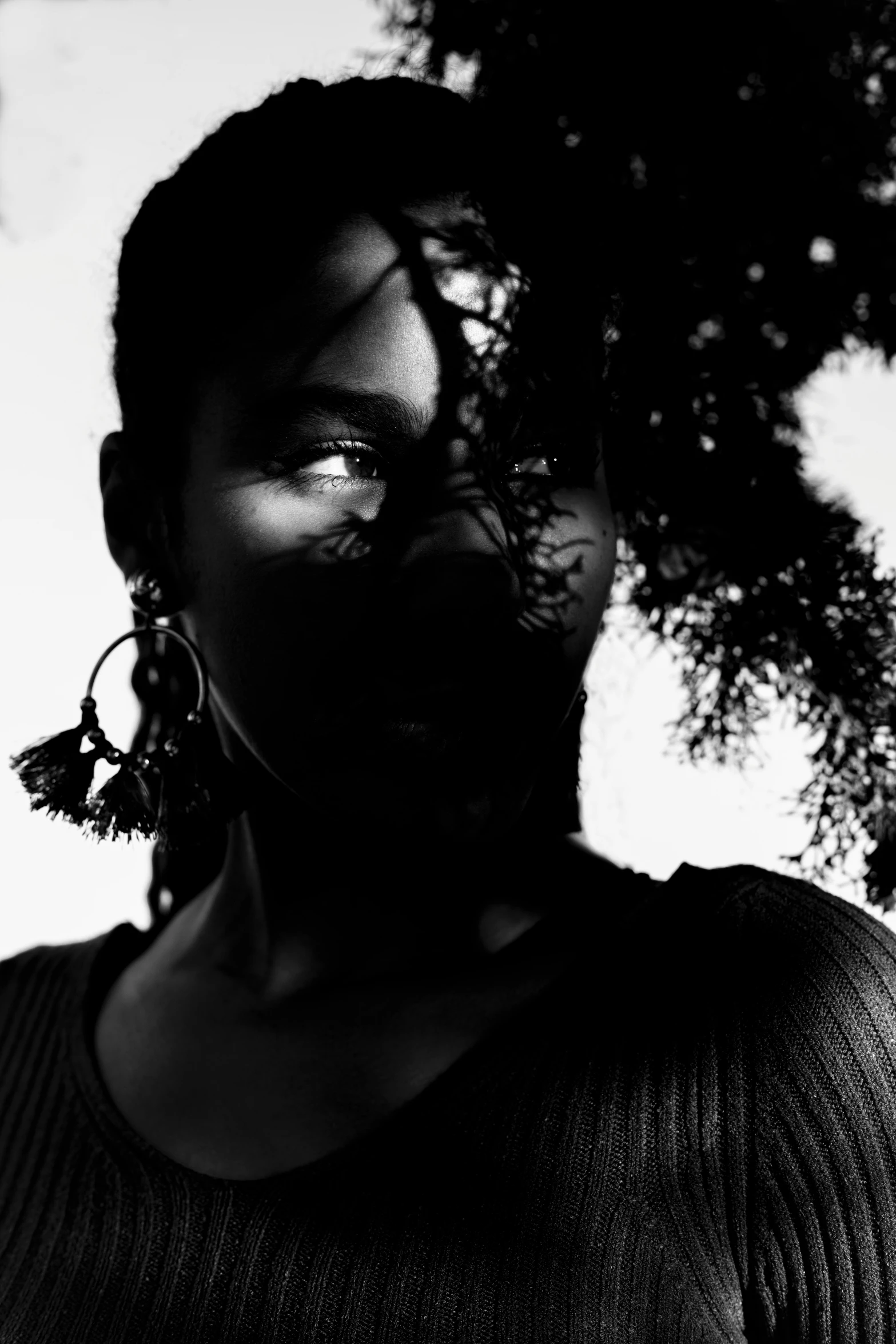 a black and white po of a woman's face