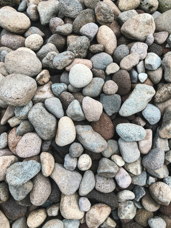 rocks are covered in different colored sand