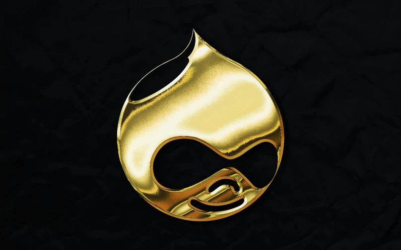 a shiny gold mask on a black background