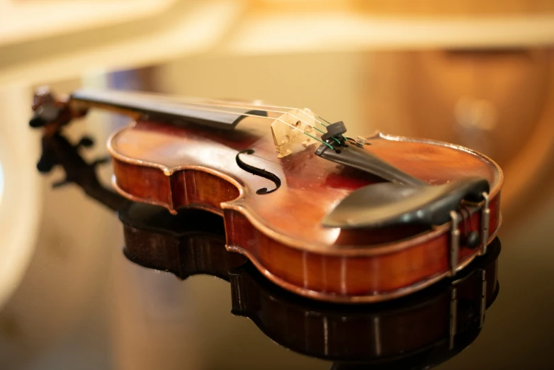 a violin that is being held up by a cord