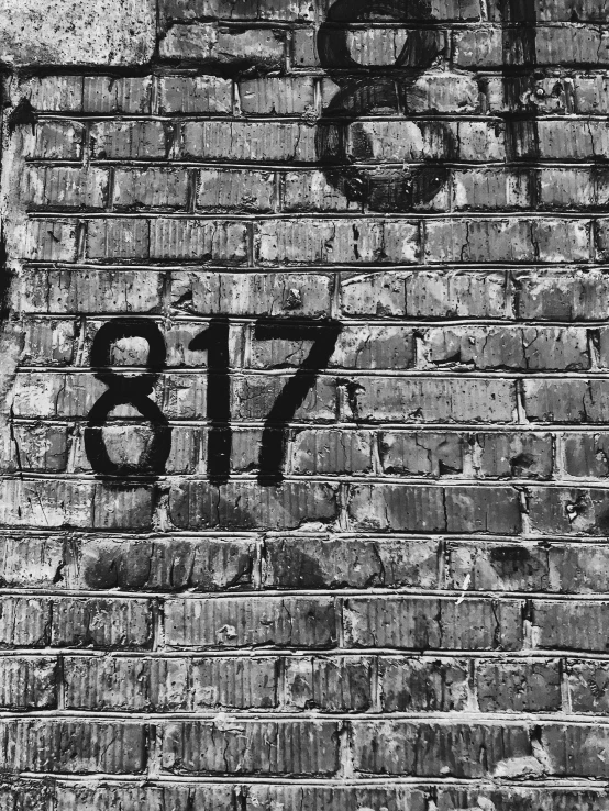 a brick wall is painted with the number thirty five
