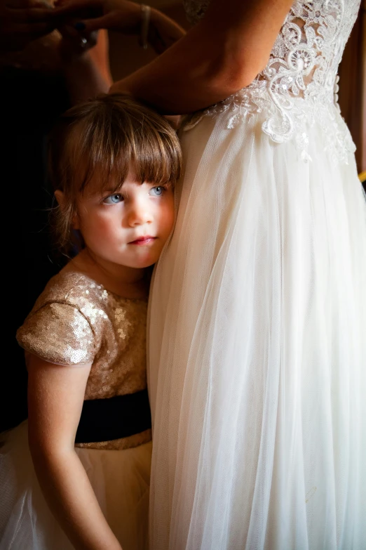 a  and an adult in formal dress