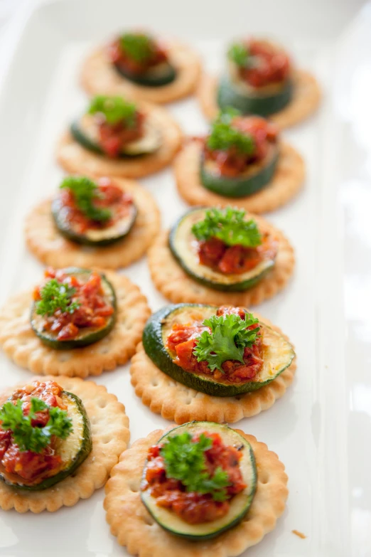 small ers with various toppings on top of a plate