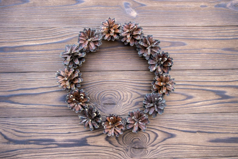 a wreath is on top of a wooden surface