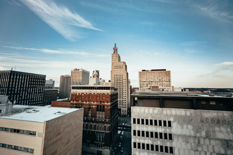 a picture of some city buildings with a sky background