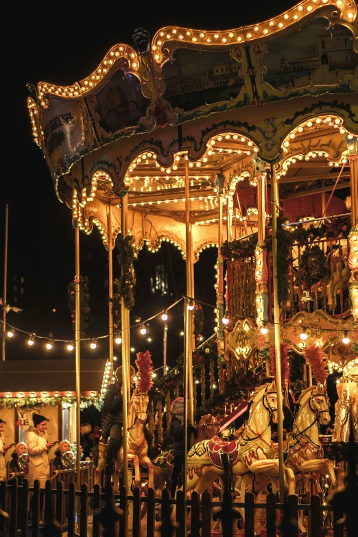 a carousel at night with lights all around