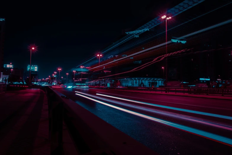 a night scene of an industrial area with the lights and streaks